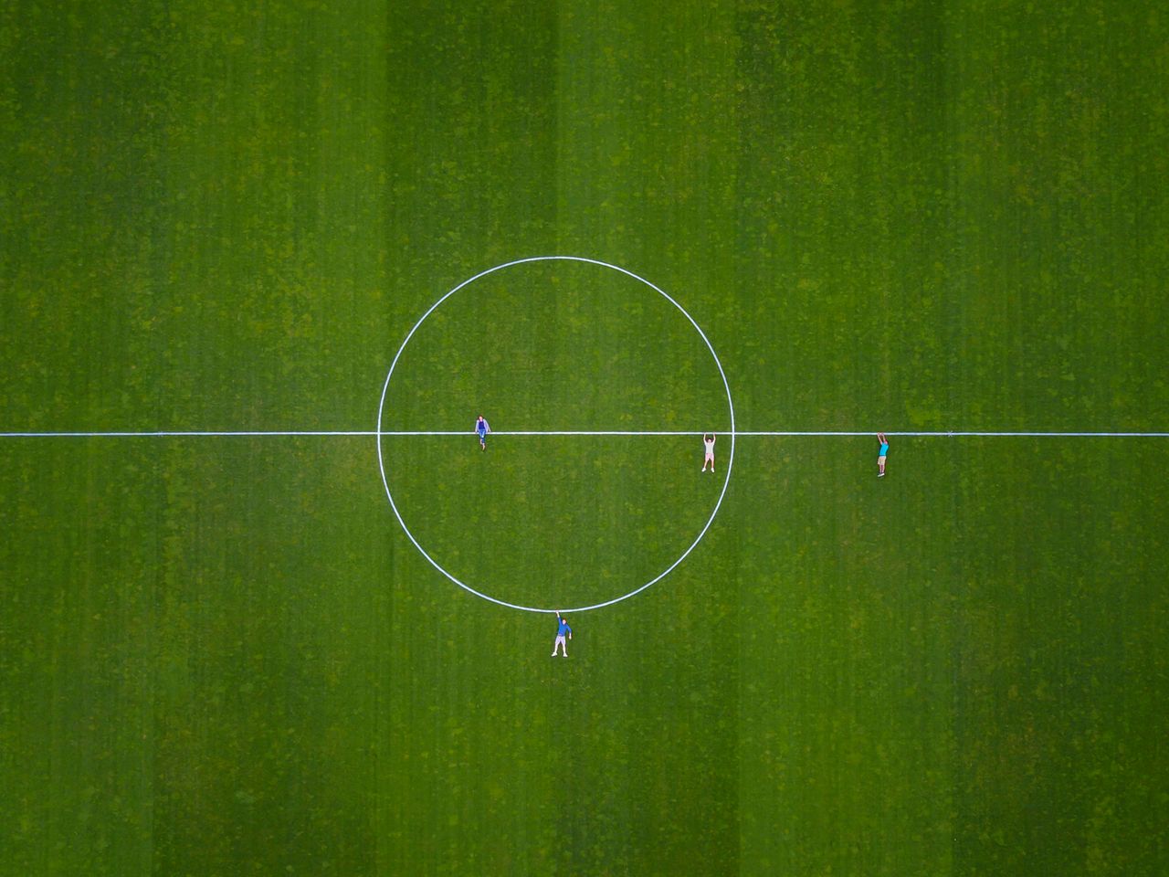 Aerial shot of people on a soccer field in Luzern, Switzerland.